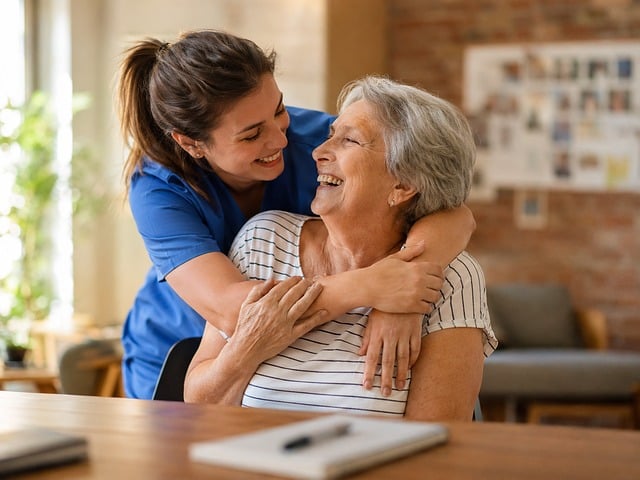 Caregiver providing emotional support to an elderly woman at home